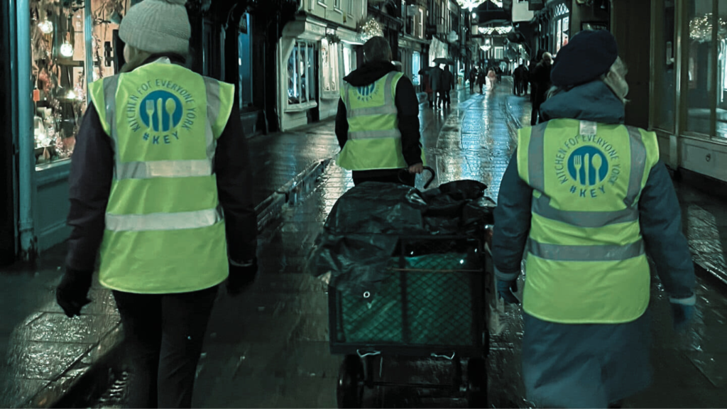 People walking with a trolley